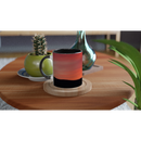 ceramic mug featuring mountain sunrise on a wooden table with plants