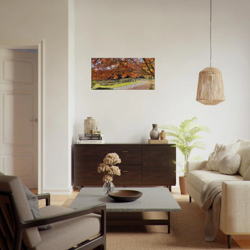 Modern living room featuring autumn road canvas art on white wall