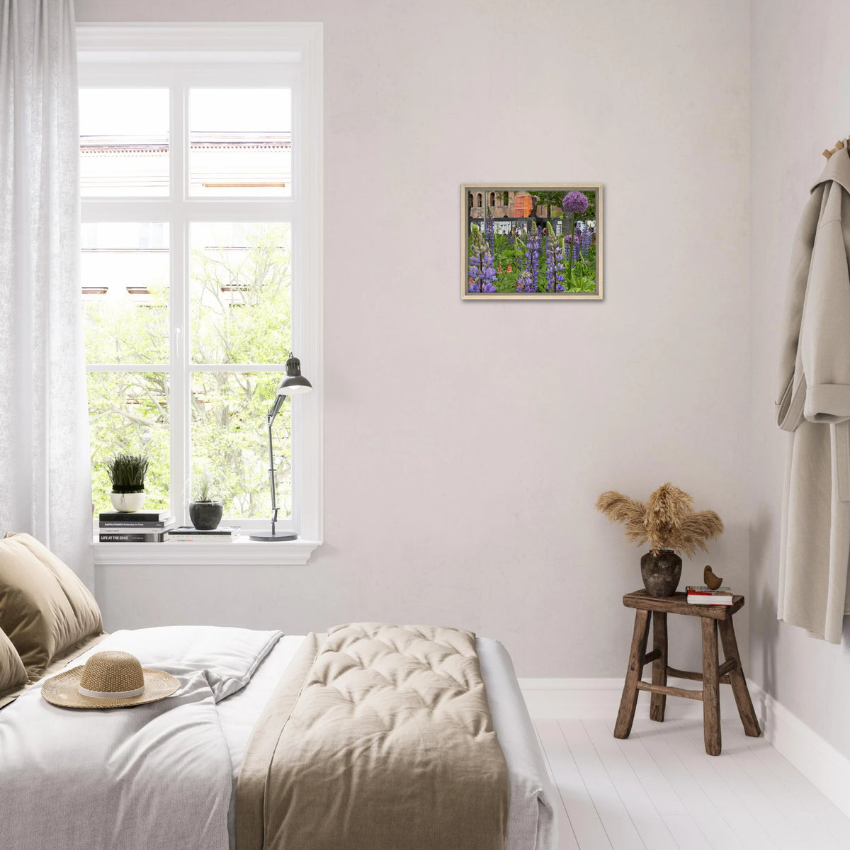 Bedroom decorated with botanical framed canvas art of purple lupine and allium flowers above a rustic stool