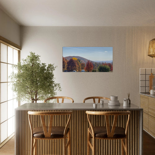 Panoramic autumn mountain canvas art displayed above a contemporary dining area