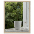 Natural wood framed canvas of incense stick in white embossed vessel on porch