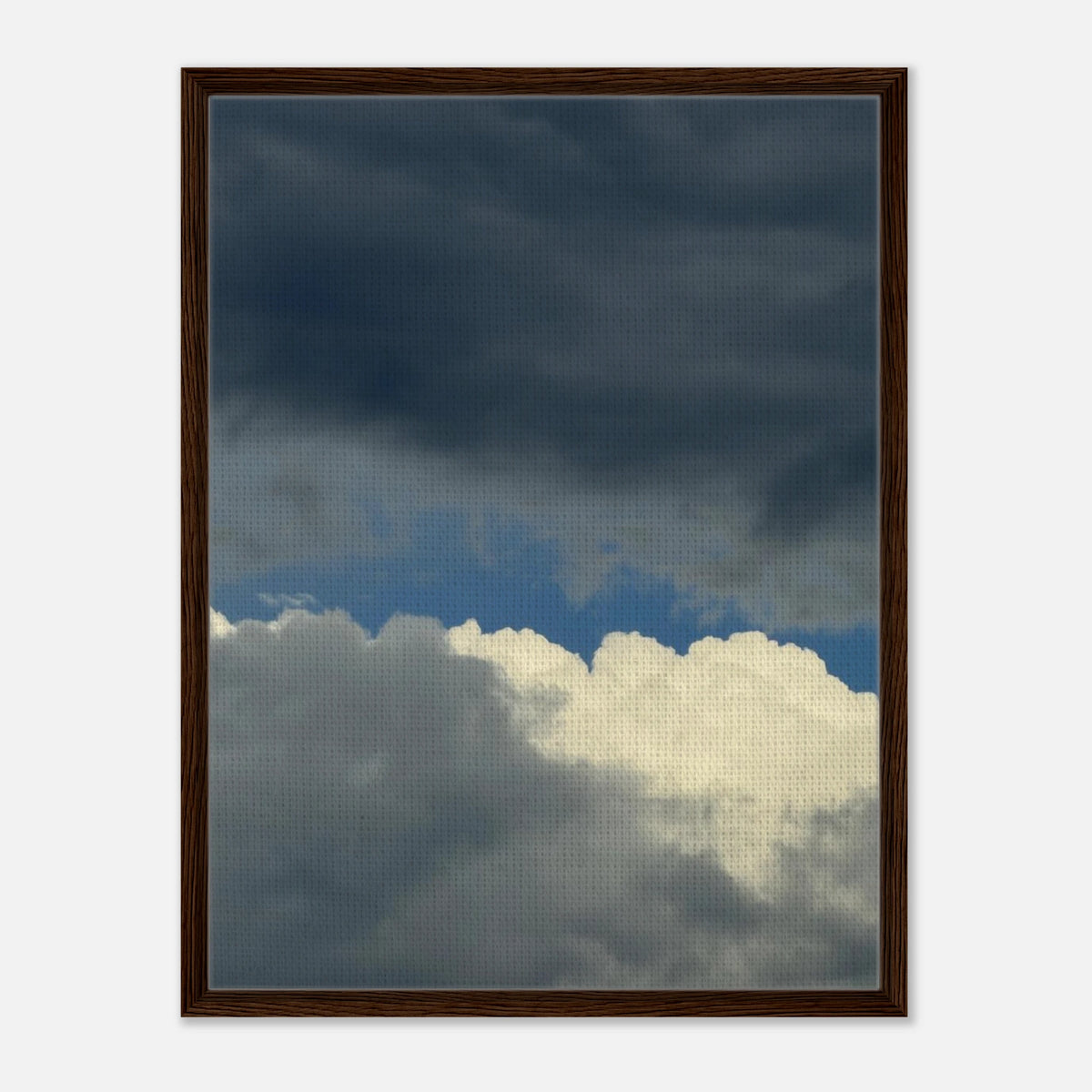 Framed canvas with dramatic sky and cloudscape, dark walnut frame