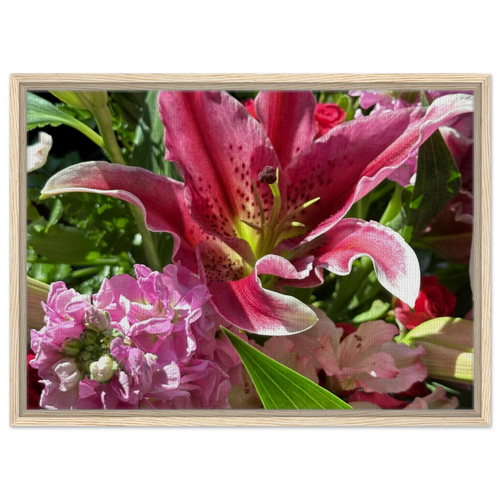Pink lily floral wall art in a light natural wood frame