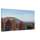 Panoramic canvas print of an autumn mountain landscape with vibrant foliage and blue sky