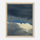 Framed canvas with dramatic sky and cloudscape in light wood