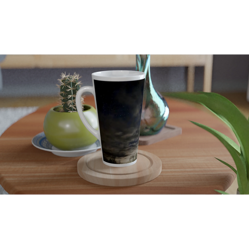 Night sky ceramic latte mug displayed on a wooden table with plants